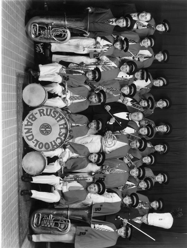 An old photo showing the student band members and teachers.